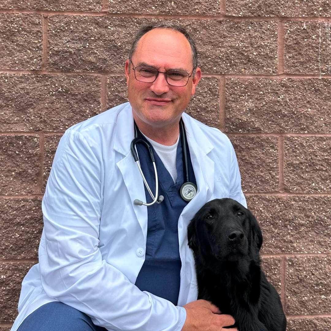 Dr. Enochs with black pet dog