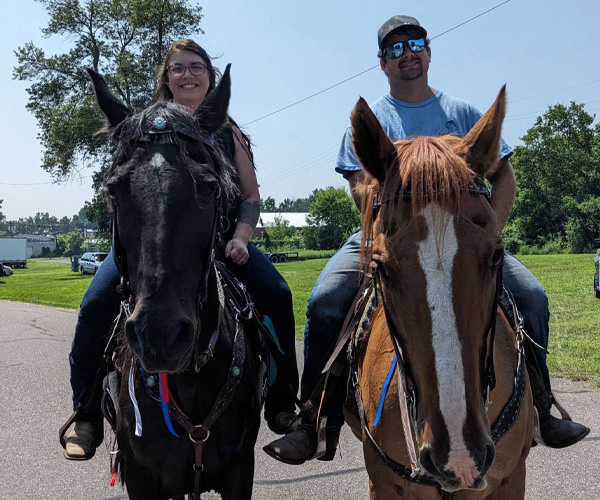 Our two team members riding horses.